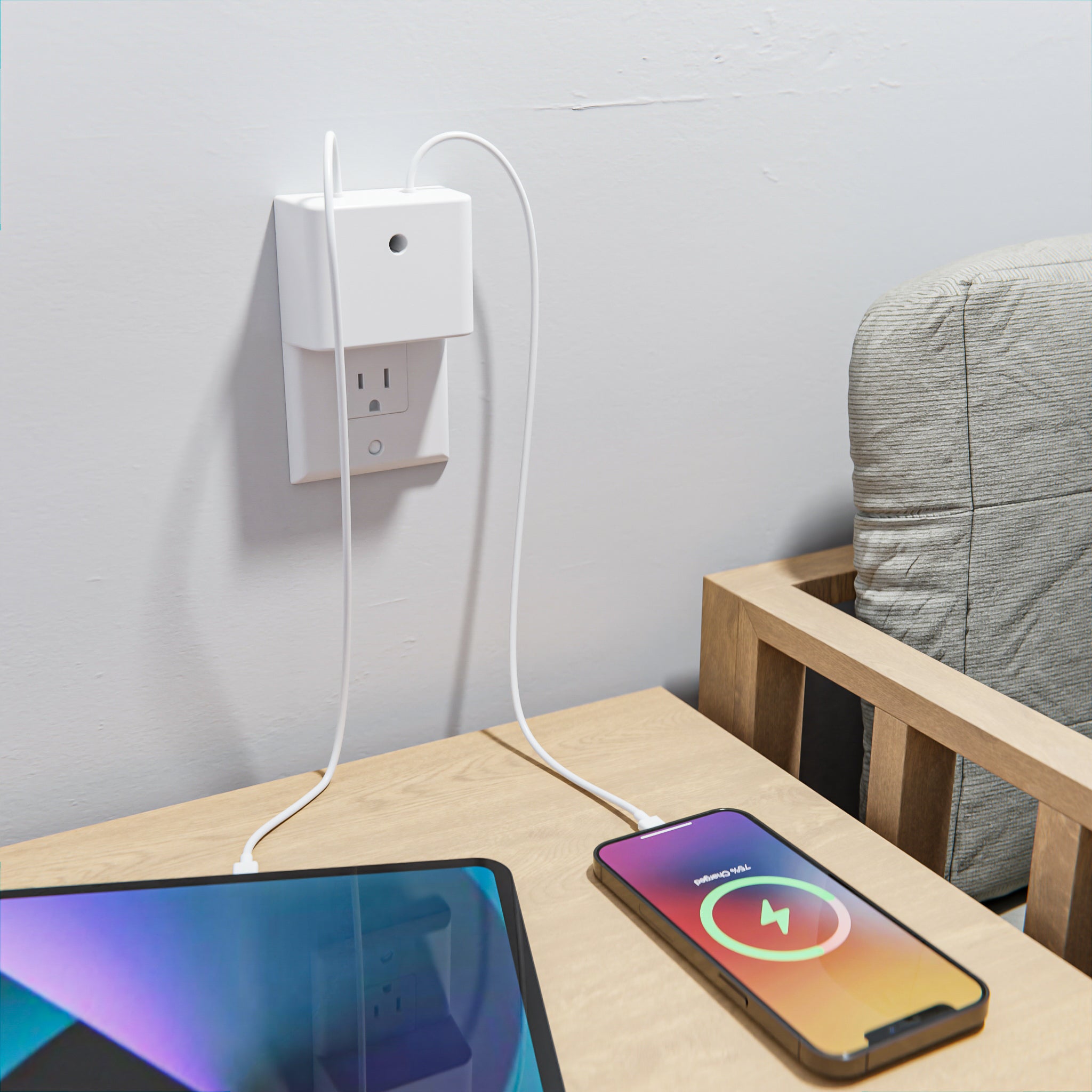 This image displays the Permaplug Charger Lock Decora model installed on a decorator-style outlet beside a bedside table. A smartphone and tablet are charging simultaneously, with cables neatly connected to the charger lock. The outlet features screw holes at the top and bottom, indicating it is compatible with Decora-style outlets. The scene highlights a clean and organized charging solution in a bedroom setting, ensuring the devices are safely and efficiently powered.
