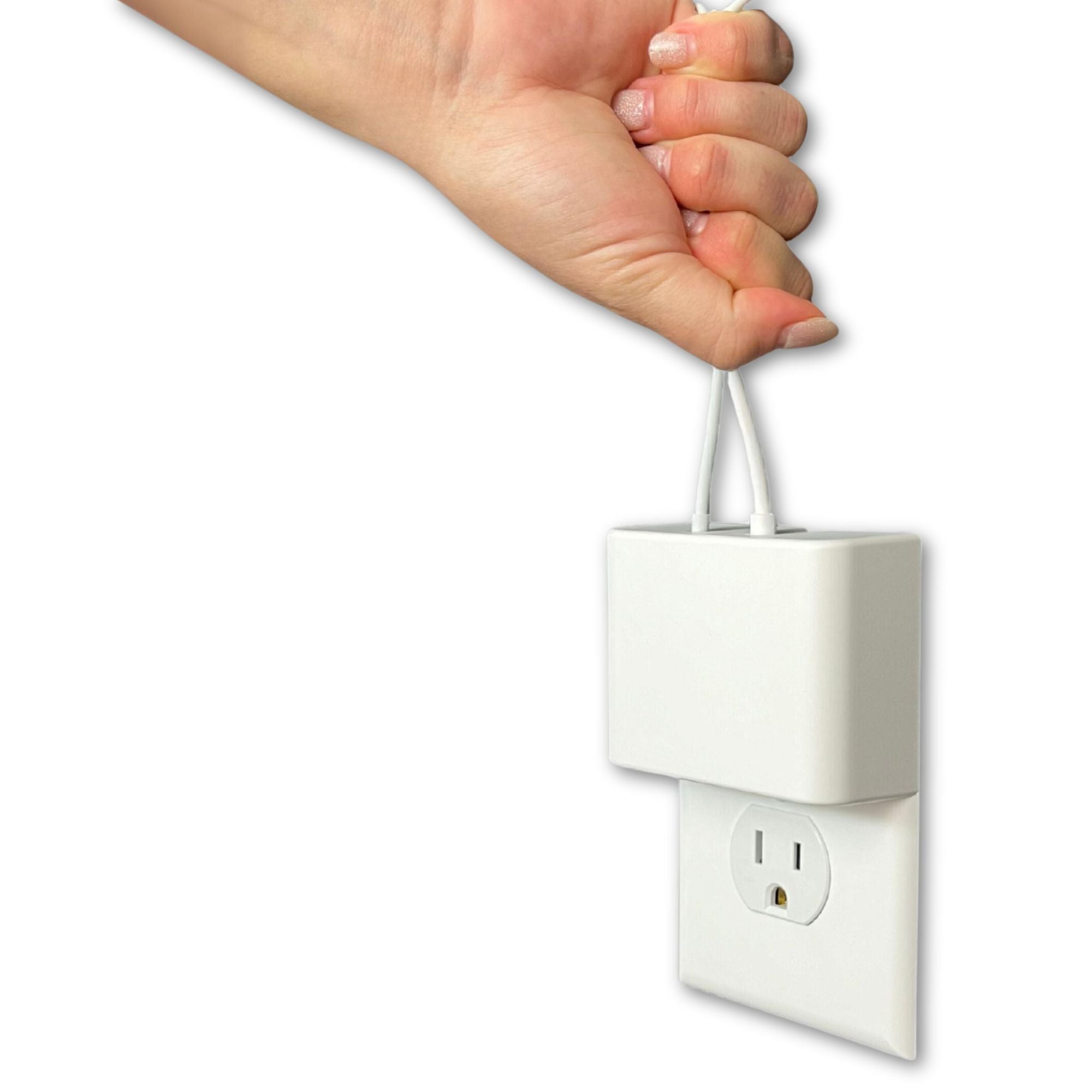 This image shows a hand gripping two cables attached to the Permaplug Charger Lock, demonstrating the secure connection between the charger and the wall outlet. The charger lock remains firmly in place, even when some tension is applied to the cables. This emphasizes the product's ability to prevent accidental disconnections, showcasing its sturdy design and reliability.
