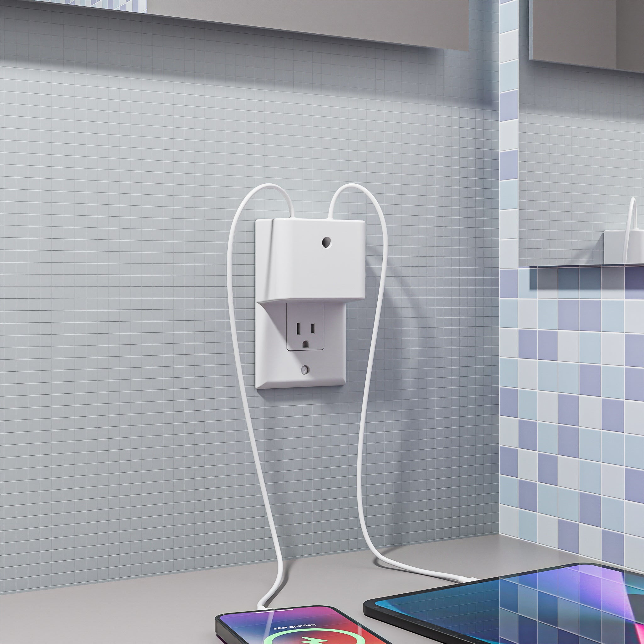 This image shows the Permaplug Charger Lock Decora model installed in a tiled bathroom or kitchen area. The charger lock is secured to a decorator-style outlet, which is identified by the screw holes at the top and bottom of the outlet cover. A smartphone and tablet are actively charging on the countertop. The setup demonstrates the Decora model's suitability for modern, tiled environments, offering a neat and efficient charging solution while maintaining a sleek aesthetic.